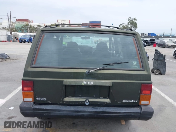 1996 Jeep Cherokee Sport z VIN 1J4FT68S6TL267408, wystawiony jako IAAI lot #42385629 z przebiegiem 268 753 mil mil oraz . Historia ofert i sprzedaży dostępna na DreamBid. Obrazek 16.