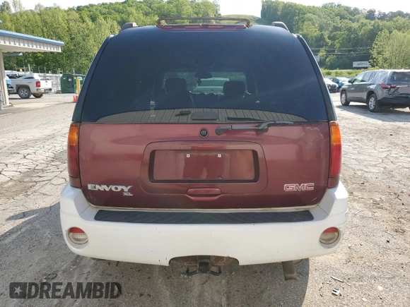 2003 GMC Envoy SLT z VIN 1GKET16S136186780, wystawiony jako Copart lot #55927155 z przebiegiem 163 099 mil mil oraz Szkoda całkowita • Salvage title. Historia ofert i sprzedaży dostępna na DreamBid. Obrazek 6.