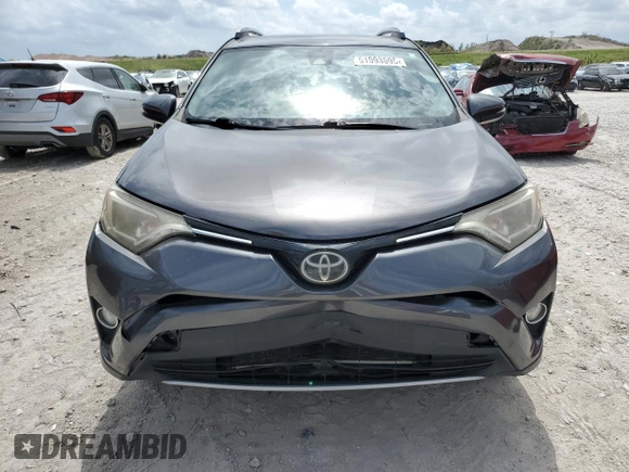2018 Toyota RAV4 XLE with VIN JTMWFREV1JJ742694, listed as a Copart auction lot 51093695 with 74,502 mi miles and Salvage Title. Bid and sale history available at DreamBid. Image 5.