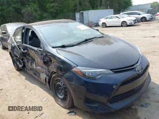 2018 Toyota Corolla L with VIN 2T1BURHE1JC052651, listed as a IAAI auction lot 42430958 with 104,664 mi miles and . Bid and sale history available at DreamBid. Image 1.