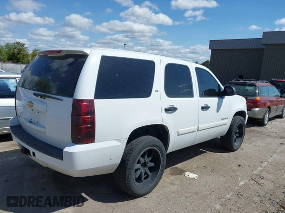 2007 Chevrolet Tahoe LS with VIN 1GNFC13C77J404051, listed as a IAAI auction lot 42093772 with 213,729 mi miles and . Bid and sale history available at DreamBid. Image 4.