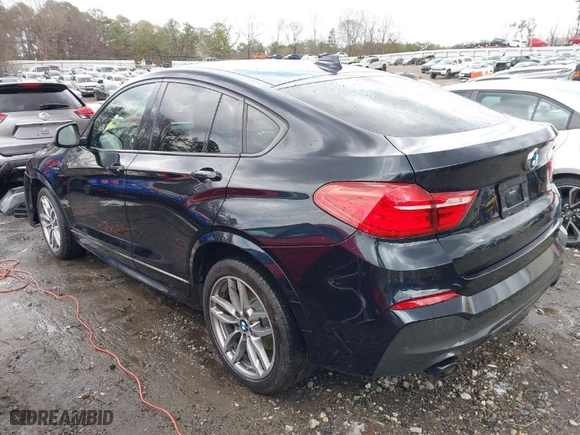 2018 BMW X4 M40i with VIN 5UXXW7C52J0W63809, listed as a IAAI auction lot 41715259 with NaN miles. Bid and sale history available at carsss.com. Image 14.
