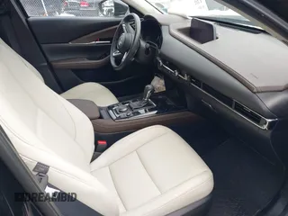 2021 Mazda CX-30 Premium with VIN 3MVDMBDY1MM269353, listed as a IAAI auction lot 41644391 with 29,409 mi miles and . Bid and sale history available at carsss.com. Image 5.