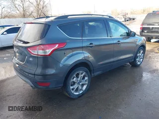 2015 Ford Escape SE with VIN 1FMCU9G98FUA70885, listed as a IAAI auction lot 41608240 with 54,802 mi miles. Bid and sale history available at carsss.com. Image 4.