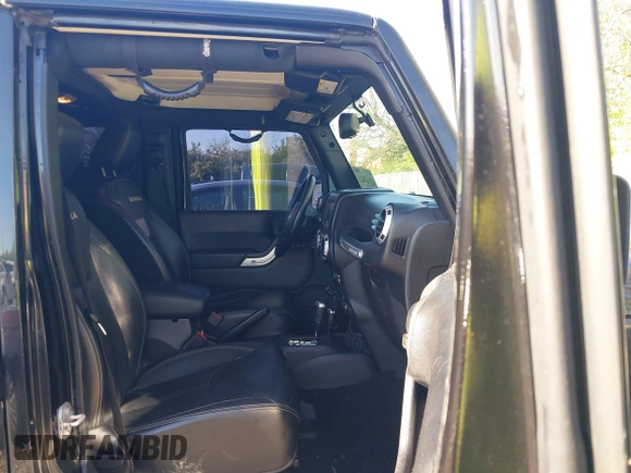 2015 Jeep Wrangler Unlimited Wrangler X with VIN 1C4BJWEG7FL677343, listed as a IAAI auction lot 42147411 with 105,920 mi miles and . Bid and sale history available at DreamBid. Image 5.