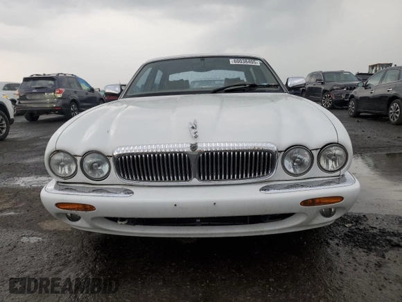 1999 Jaguar XJ with VIN SAJKD6041XC876928, listed as a Copart auction lot 60038405 with 63,917 mi miles and Clean title. Bid and sale history available at DreamBid. Image 5.