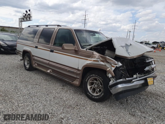 1999 Chevrolet Suburban with VIN 3GNEC16R9XG143471, listed as a Copart auction lot 53856565 with 208,621 mi miles and Salvage title. Bid and sale history available at DreamBid. Image 4.