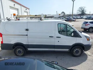 2016 Ford Transit Cargo z VIN 1FTYR1YM1GKB55452, wystawiony jako IAAI lot #41850416 z przebiegiem 91 973 mil mil oraz . Historia ofert i sprzedaży dostępna na DreamBid. Obrazek 13.