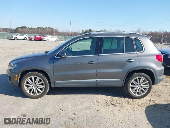 2012 Volkswagen Tiguan SE with VIN WVGAV7AX5CW000275, listed as a IAAI auction lot 41789246 with 123,618 mi miles and . Bid and sale history available at DreamBid. Image 14.
