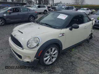 2013 MINI Coupe S with VIN WMWSX3C53DT466648, listed as a IAAI auction lot 41719597 with 106,936 mi miles and . Bid and sale history available at DreamBid. Image 18.