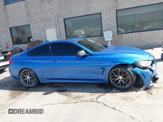 2015 BMW 4 Series 435i with VIN WBA3R1C50FF774588, listed as a IAAI auction lot 42001394 with 96,400 mi miles and . Bid and sale history available at carsss.com. Image 14.