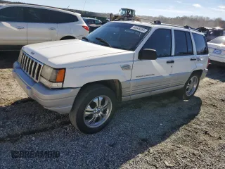 1996 Jeep Grand Cherokee Laredo with VIN 1J4FX58SXTC349575, listed as a Copart auction lot 80545584 with 302,636 mi miles and Salvage Title. Bid and sale history available at carsss.com. Image 1.