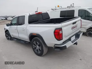2023 GMC Canyon 4WD AT4 with VIN 1GTP6DEK0P1221777, listed as a IAAI auction lot 41564754 with 21,974 mi miles. Bid and sale history available at carsss.com. Image 3.