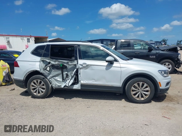 2018 Volkswagen Tiguan SEL with VIN 3VV3B7AX5JM053045, listed as a IAAI auction lot 41963017 with 77,495 mi miles and . Bid and sale history available at DreamBid. Image 13.