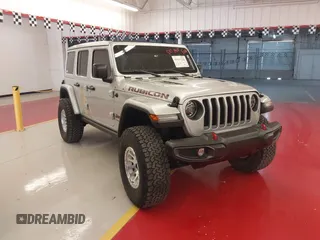 2022 Jeep Wrangler Unlimited Rubicon z VIN 1C4JJXFM7NW156139, wystawiony jako IAAI lot #42425550 z przebiegiem 30 654 mil mil oraz . Historia ofert i sprzedaży dostępna na DreamBid. Obrazek 1.