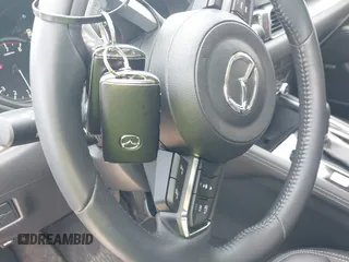 2024 Mazda CX-5 S Premium z VIN JM3KFBDLXR0486618, wystawiony jako IAAI lot #42055952 z przebiegiem 4559 mil mil oraz . Historia ofert i sprzedaży dostępna na DreamBid. Obrazek 11.