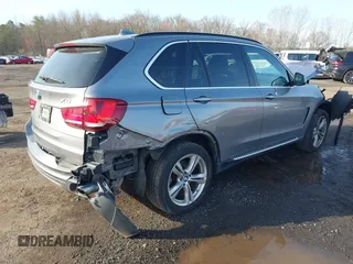 2014 BMW X5 xDrive35i z VIN 5UXKR0C52E0H19670, wystawiony jako IAAI lot #41909590 z przebiegiem 137 758 mil mil oraz . Historia ofert i sprzedaży dostępna na DreamBid. Obrazek 4.
