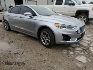 2020 Ford Fusion SEL с VIN 3FA6P0CD4LR148327, выставлен на аукционе Copart как лот 55099855 с пробегом Не указан миль и Списание • Salvage title. История ставок и продаж доступна на DreamBid. Изображение 4.