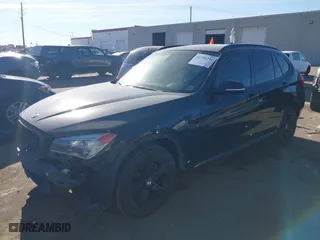 2014 BMW X1 xDrive28i with VIN WBAVL1C58EVY11143, listed as a IAAI auction lot 41396236 with 115,667 mi miles. Bid and sale history available at carsss.com. Image 2.