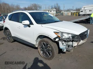 2016 Mazda CX-5 Grand Touring with VIN JM3KE4DYXG0836692, listed as a IAAI auction lot 41812584 with 119,302 mi miles. Bid and sale history available at carsss.com. Image 1.
