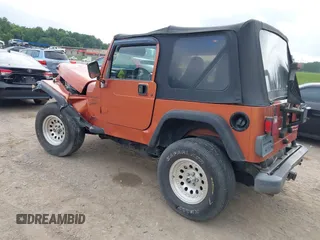 2001 Jeep Wrangler Sport z VIN 1J4FA49S01P341940, wystawiony jako IAAI lot #42542715 z przebiegiem 87 651 mil mil oraz . Historia ofert i sprzedaży dostępna na DreamBid. Obrazek 3.