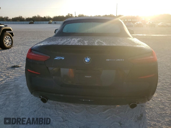 2020 BMW Z4 sDrive30i with VIN WBAHF3C03LWW64905, listed as a Copart auction lot 77010554 with 27,612 mi miles and Salvage Title. Bid and sale history available at carsss.com. Image 6.