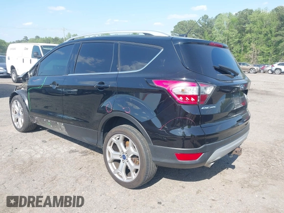 2017 Ford Escape Titanium with VIN 1FMCU0J91HUA75417, listed as a IAAI auction lot 42044170 with 116,431 mi miles. Bid and sale history available at carsss.com. Image 3.