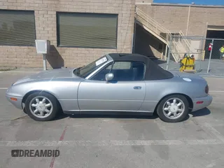 1991 Mazda MX-5 Miata Special Edition z VIN JM1NA3511M1235948, wystawiony jako IAAI lot #42322754 z przebiegiem 151 065 mil mil oraz . Historia ofert i sprzedaży dostępna na DreamBid. Obrazek 14.