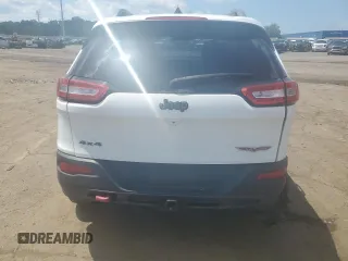 2015 Jeep Cherokee Trailhawk with VIN 1C4PJMBSXFW651000, listed as a Copart auction lot 64110515 with 135,571 mi miles and Clean title. Bid and sale history available at DreamBid. Image 6.