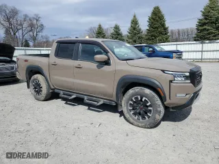 2022 Nissan Frontier PRO-4X with VIN 1N6ED1EK0NN671881, listed as a Copart auction lot 49579385 with 22,061 mi miles and Salvage Title. Bid and sale history available at carsss.com. Image 4.