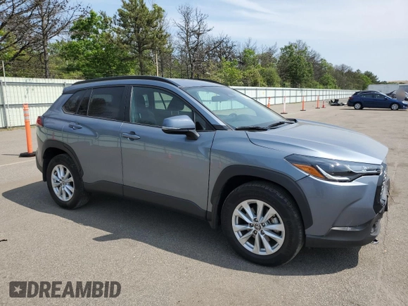 2023 Toyota Corolla Cross LE with VIN 7MUCAABG4PV054828, listed as a Copart auction lot 59466855 with 23,884 mi miles and Salvage title. Bid and sale history available at DreamBid. Image 4.