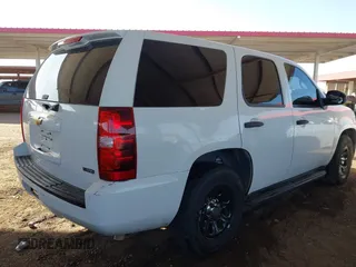 2007 Chevrolet Tahoe Police z VIN 1GNEC03097R414206, wystawiony jako IAAI lot #41698793 z przebiegiem 188 773 mil mil oraz . Historia ofert i sprzedaży dostępna na DreamBid. Obrazek 4.