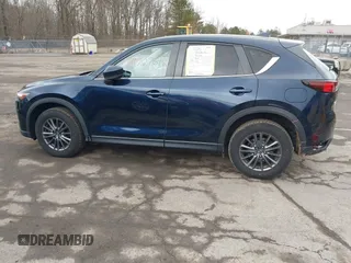 2021 Mazda CX-5 Touring with VIN JM3KFBCM7M1380396, listed as a IAAI auction lot 41707612 with 55,555 mi miles. Bid and sale history available at carsss.com. Image 14.