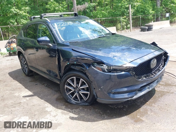 2018 Mazda CX-5 Grand Touring with VIN JM3KFBDM2J0373386, listed as a IAAI auction lot 42200795 with 70,111 mi miles and . Bid and sale history available at DreamBid. Image 6.