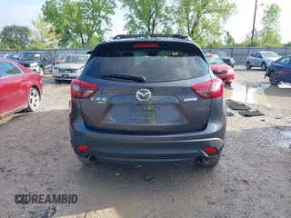 2016 Mazda CX-5 Grand Touring with VIN JM3KE4DYXG0724183, listed as a IAAI auction lot 42176009 with 152,695 mi miles and . Bid and sale history available at DreamBid. Image 16.