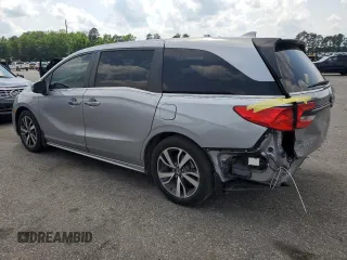 2021 Honda Odyssey Touring z VIN 5FNRL6H85MB039444, wystawiony jako Copart lot #57142205 z przebiegiem 74 228 mil mil oraz Szkoda całkowita • Salvage title. Historia ofert i sprzedaży dostępna na DreamBid. Obrazek 2.
