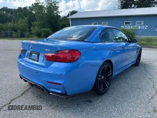 2015 BMW M4 with VIN WBS3U9C56FP967640, listed as a Copart auction lot 63641785 with 31,516 mi miles and Salvage title. Bid and sale history available at DreamBid. Image 4.