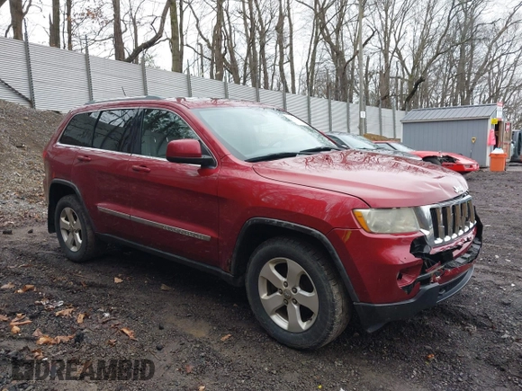 2012 Jeep Grand Cherokee Laredo with VIN 1C4RJFAG7CC123669, listed as a IAAI auction lot 42001472 with 164,806 mi miles. Bid and sale history available at carsss.com. Image 1.