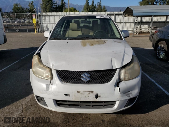 2011 Suzuki SX4 LE with VIN JS2YC5A21B6300207, listed as a Copart auction lot 77040354 with 162,915 mi miles and Salvage Title. Bid and sale history available at carsss.com. Image 5.