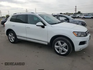 2013 Volkswagen Touareg Sport с VIN WVGEP9BP9DD003974, выставлен на аукционе Copart как лот 75106234 с пробегом 211 323 миль миль и Чистый • Clean title. История ставок и продаж доступна на DreamBid. Изображение 4.