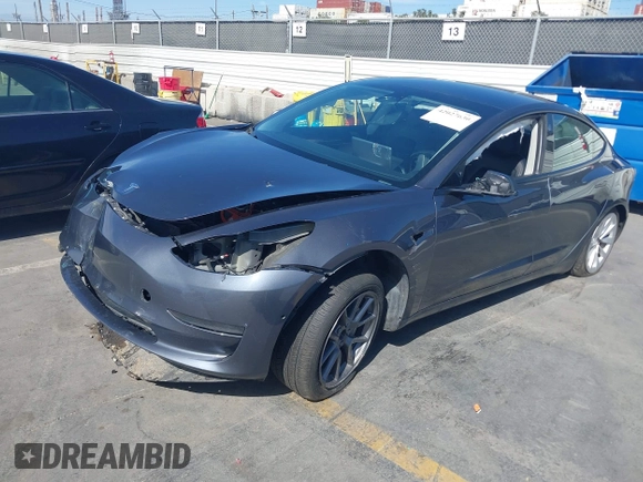 2022 Tesla Model 3 with VIN 5YJ3E1EA1NF142713, listed as a IAAI auction lot 42027630 with 112,557 mi miles. Bid and sale history available at carsss.com. Image 16.