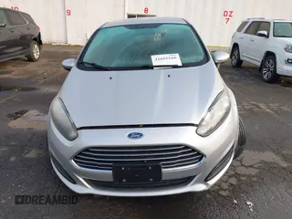 2019 Ford Fiesta SE z VIN 3FADP4EJ7KM147864, wystawiony jako IAAI lot #41692160 z przebiegiem 87 417 mil mil oraz . Historia ofert i sprzedaży dostępna na DreamBid. Obrazek 12.