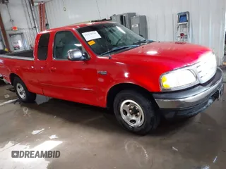 1999 Ford F-150 with VIN 1FTZX1721XKA15945, listed as a IAAI auction lot 41279291 with 153,229 mi miles and . Bid and sale history available at DreamBid. Image 1.