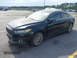 2016 Ford Fusion Titanium with VIN 3FA6P0K90GR179528, listed as a IAAI auction lot 42181213 with 230,264 mi miles. Bid and sale history available at carsss.com. Image 2.