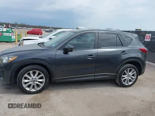 2014 Mazda CX-5 Grand Touring with VIN JM3KE2DY0E0354220, listed as a IAAI auction lot 41885502 with 168,901 mi miles. Bid and sale history available at carsss.com. Image 14.