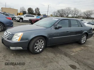 2009 Cadillac DTS 1SC z VIN 1G6KD57Y69U133912, wystawiony jako Copart lot #79253734 z przebiegiem 100 684 mil mil oraz Szkoda całkowita • Salvage title. Historia ofert i sprzedaży dostępna na DreamBid. Obrazek 1.