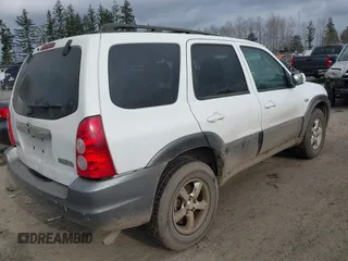 2005 Mazda Tribute LX with VIN 4F2CZ94105KM25420, listed as a IAAI auction lot 41450750 with 148,736 mi miles. Bid and sale history available at carsss.com. Image 4.