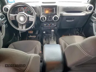 2015 Jeep Wrangler Unlimited Sahara with VIN 1C4BJWEG4FL668339, listed as a Copart auction lot 61221325 with 117,887 mi miles and Salvage title. Bid and sale history available at DreamBid. Image 8.
