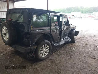2023 Jeep Wrangler Willys with VIN 1C4HJXDG0PW617101, listed as a IAAI auction lot 42111687 with 56,415 mi miles and . Bid and sale history available at DreamBid. Image 4.