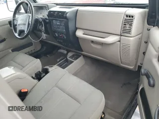 2004 Jeep Wrangler Sahara with VIN 1J4FA59SX4P713343, listed as a Copart auction lot 53608265 with 113,828 mi miles and Salvage title. Bid and sale history available at DreamBid. Image 8.